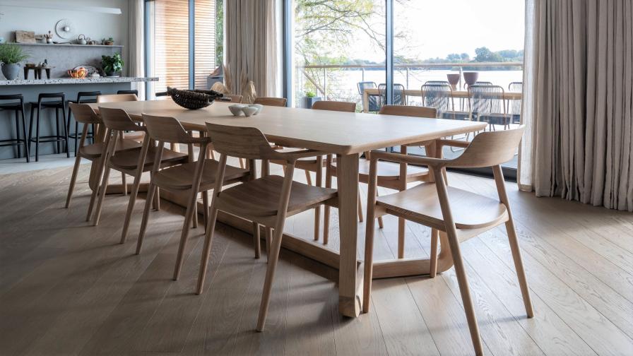 dining table with light oak floor and lakeview